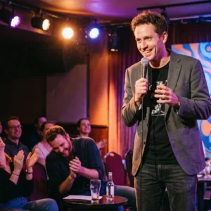 A comedian telling jokes on stage
